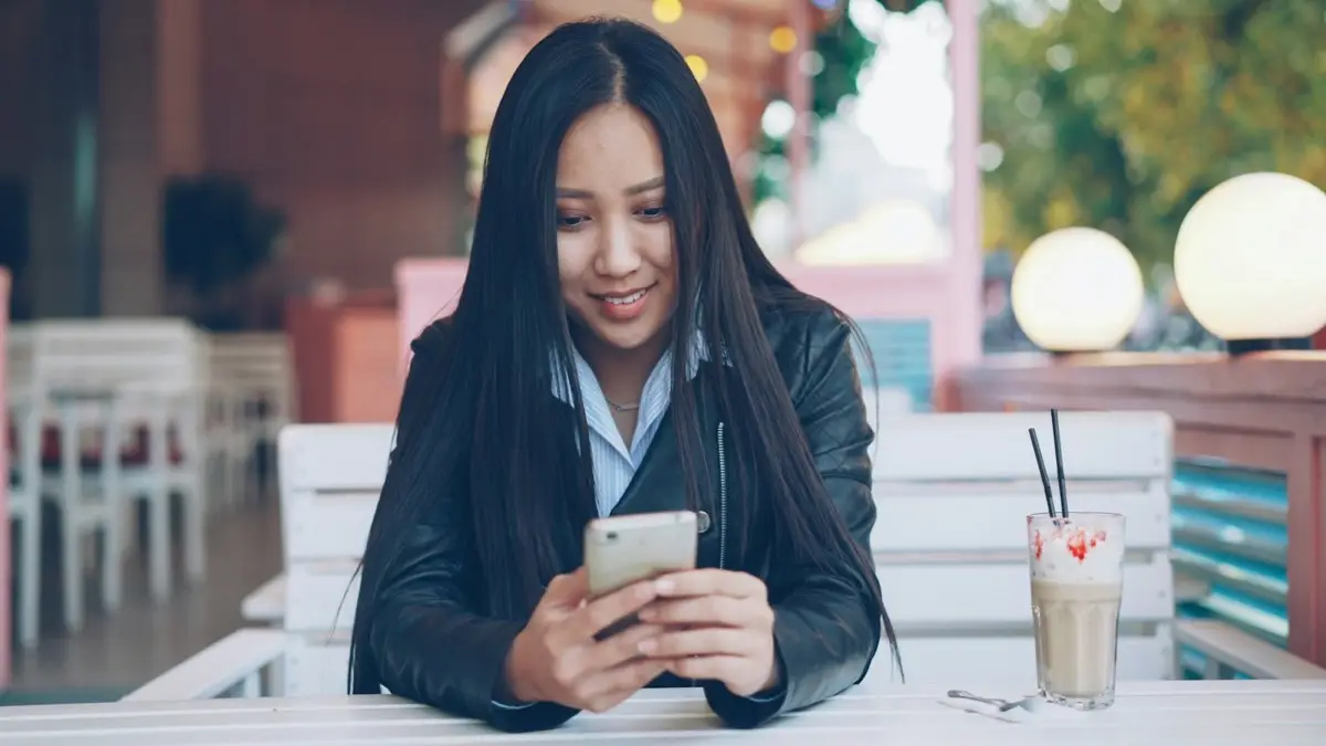 Someone looking up a local business on a phone