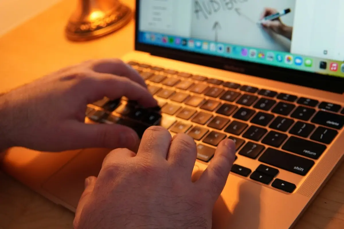 A person drafting a reply at a desk
