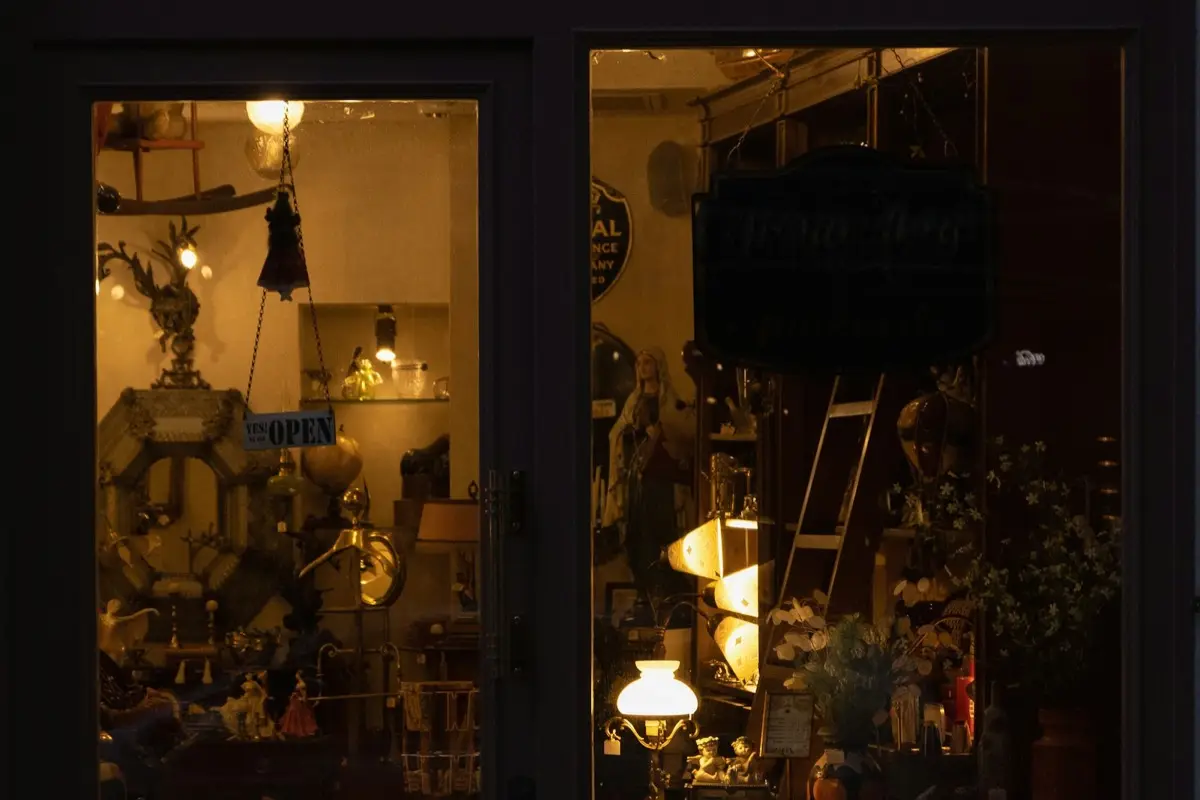 A shopfront lit up at dusk